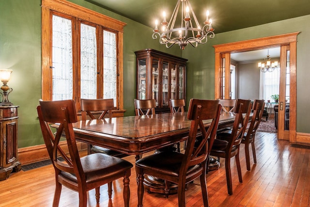 1412 Bryden Rd, Columbus, OH 43205 - dining space featuring a chandelier and light wood-type flooring