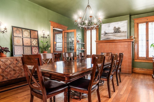 1412 Bryden Rd, Columbus, OH 43205 - dining space with a chandelier and hardwood / wood-style floors
