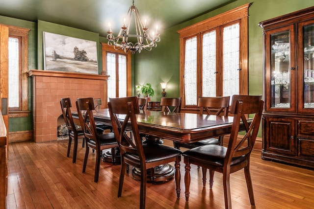 1412 Bryden Rd, Columbus, OH 43205 - dining area featuring a chandelier and wood-type flooring