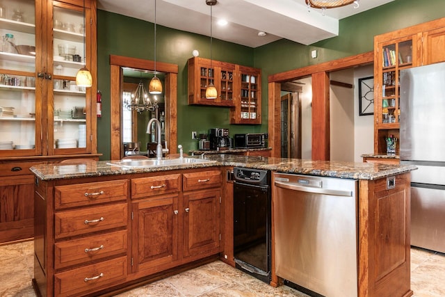 1412 Bryden Rd, Columbus, OH 43205 - kitchen with stainless steel appliances, brown cabinets, a peninsula, dark stone countertops, and glass insert cabinets