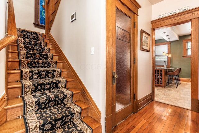 1412 Bryden Rd, Columbus, OH 43205 - stairway featuring hardwood / wood-style flooring and baseboards