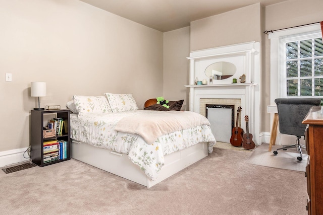 1412 Bryden Rd, Columbus, OH 43205 - carpeted bedroom with a fireplace and baseboards