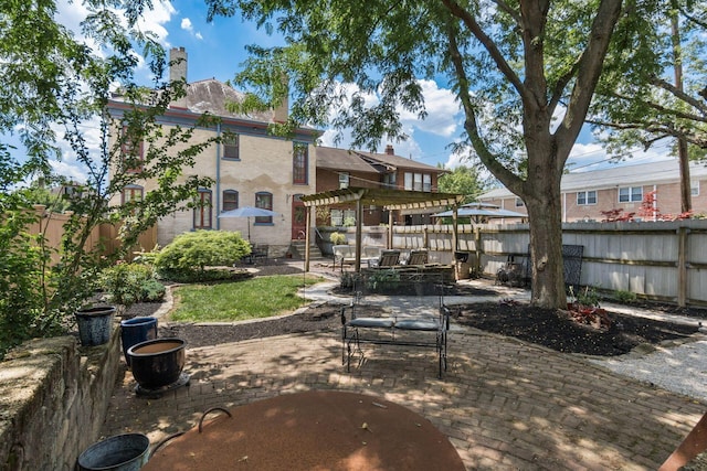 1412 Bryden Rd, Columbus, OH 43205 - fenced backyard featuring a pergola, a patio area, and outdoor dining space