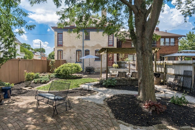 1412 Bryden Rd, Columbus, OH 43205 - back of house featuring a patio area