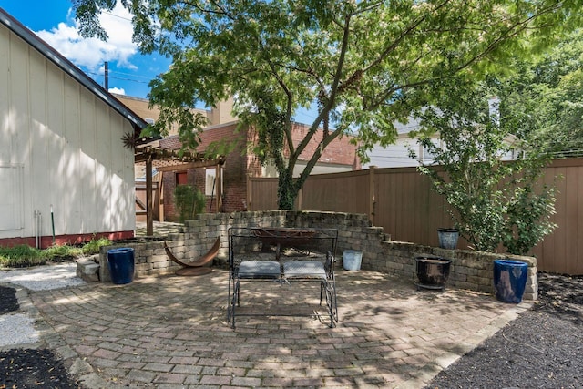 1412 Bryden Rd, Columbus, OH 43205 - fenced backyard with a patio area