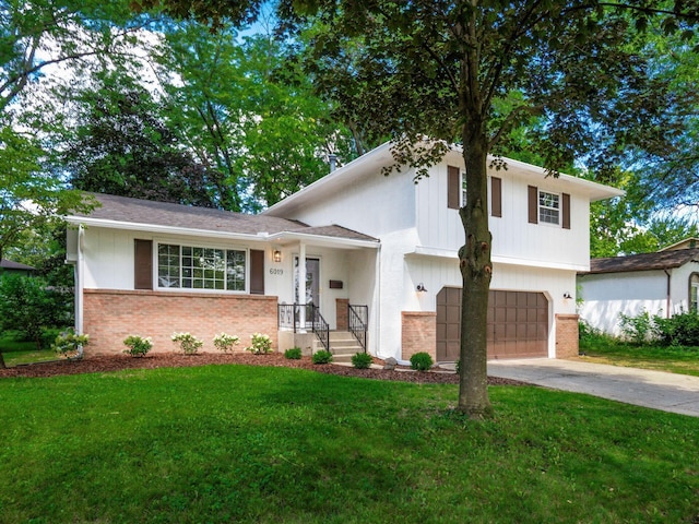 6019 Beechcroft Rd, Columbus, OH 43229 - split level home featuring brick siding, an attached garage, concrete driveway, and a front yard