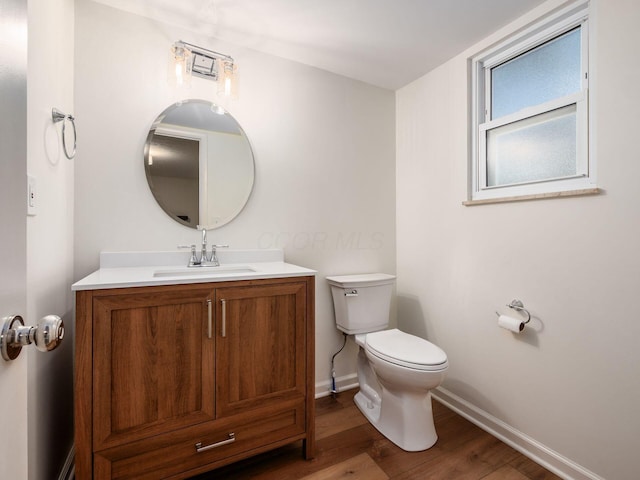 6019 Beechcroft Rd, Columbus, OH 43229 - half bathroom featuring wood finished floors and vanity