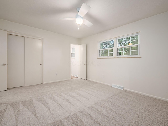 6019 Beechcroft Rd, Columbus, OH 43229 - unfurnished bedroom featuring carpet flooring, a ceiling fan, and a closet