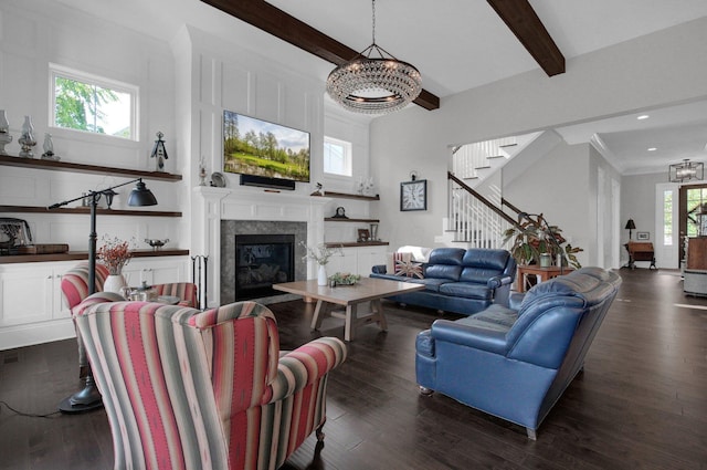 7211 Craigens Ct, Plain City, OH 43064 - living area featuring a chandelier, stairs, beam ceiling, dark wood finished floors, and a tiled fireplace