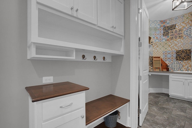 7211 Craigens Ct, Plain City, OH 43064 - mudroom with built in desk and stone finish floors