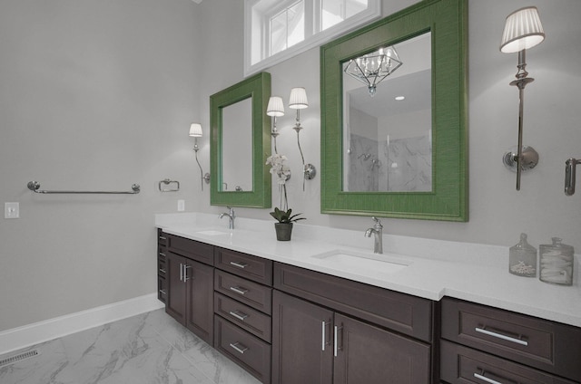 7211 Craigens Ct, Plain City, OH 43064 - bathroom with double vanity, marble look tiles, a marble finish shower, and a chandelier