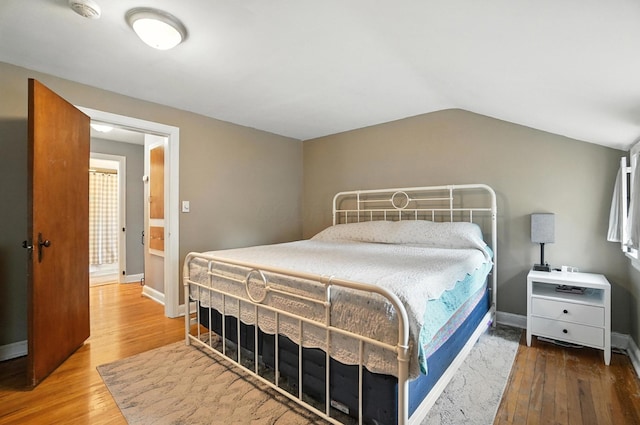 613 Salisbury Rd, Columbus, OH 43204 - bedroom with wood finished floors and vaulted ceiling