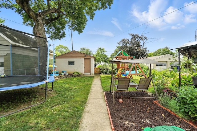 613 Salisbury Rd, Columbus, OH 43204 - view of yard with a trampoline, a playground, and an outdoor structure