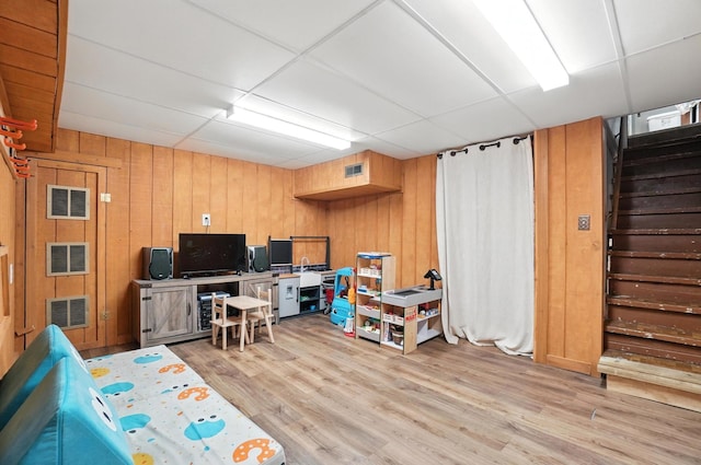 613 Salisbury Rd, Columbus, OH 43204 - office featuring a drop ceiling, light wood-type flooring, and wood walls