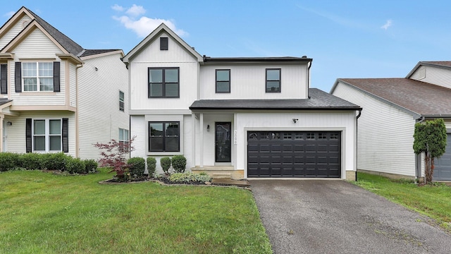 3099 Ambarwent Rd, Reynoldsburg, OH 43068 - view of front of house featuring asphalt driveway and a front yard