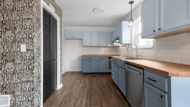 3099 Ambarwent Rd, Reynoldsburg, OH 43068 - kitchen featuring wooden counters, stainless steel dishwasher, dark wood finished floors, blue cabinetry, and backsplash