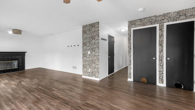 3099 Ambarwent Rd, Reynoldsburg, OH 43068 - unfurnished living room with wood finished floors, ceiling fan, and a tiled fireplace
