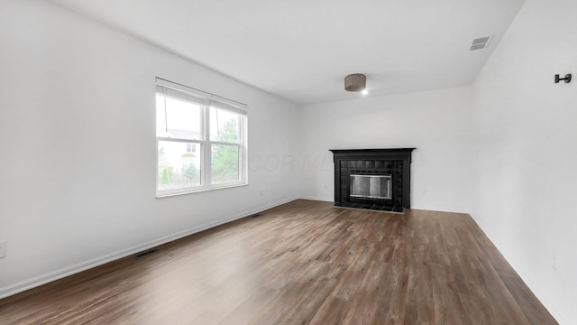 3099 Ambarwent Rd, Reynoldsburg, OH 43068 - unfurnished living room with wood finished floors and a fireplace with flush hearth