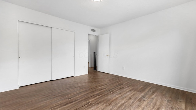 3099 Ambarwent Rd, Reynoldsburg, OH 43068 - unfurnished bedroom featuring dark wood-style floors and a closet