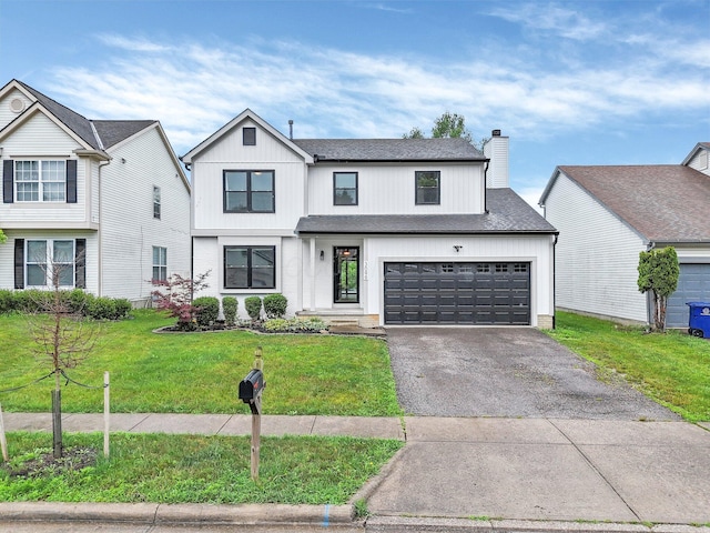 3099 Ambarwent Rd, Reynoldsburg, OH 43068 - modern inspired farmhouse featuring asphalt driveway, a chimney, a front lawn, and a shingled roof