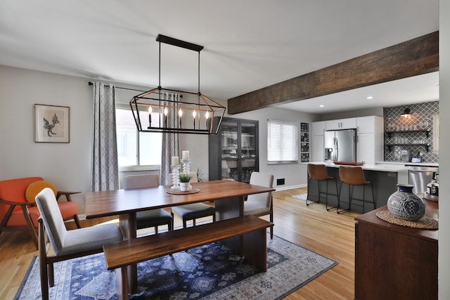 315 S Kellner Rd, Columbus, OH 43209 - dining space featuring a chandelier, light wood-type flooring, recessed lighting, and beam ceiling