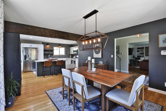 315 S Kellner Rd, Columbus, OH 43209 - dining space featuring light wood finished floors and a chandelier