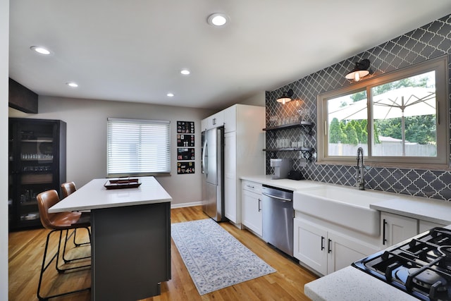315 S Kellner Rd, Columbus, OH 43209 - kitchen with appliances with stainless steel finishes, plenty of natural light, light countertops, a center island, and recessed lighting