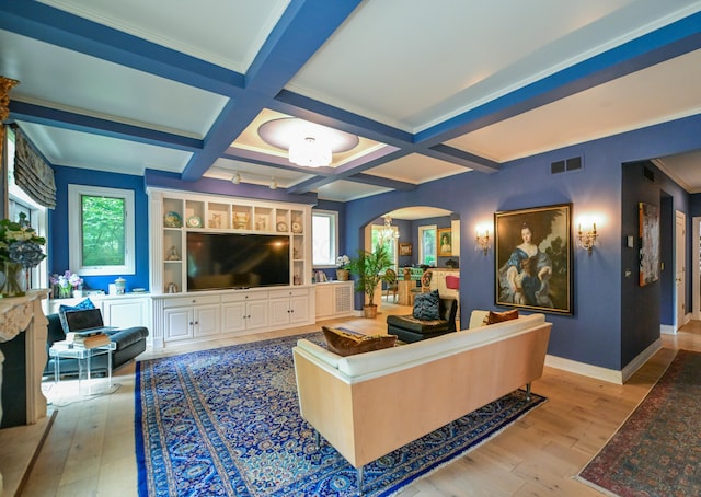 7394 Whitlind Ln, Athens, OH 45701 - living room with arched walkways, light wood-style floors, healthy amount of natural light, beam ceiling, and coffered ceiling