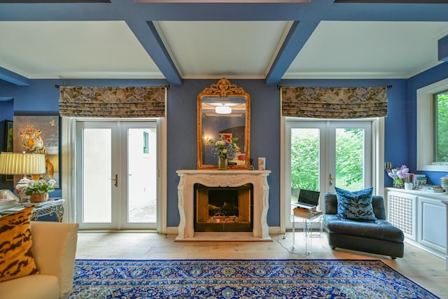 7394 Whitlind Ln, Athens, OH 45701 - living area featuring french doors, a premium fireplace, wood finished floors, beamed ceiling, and ornamental molding