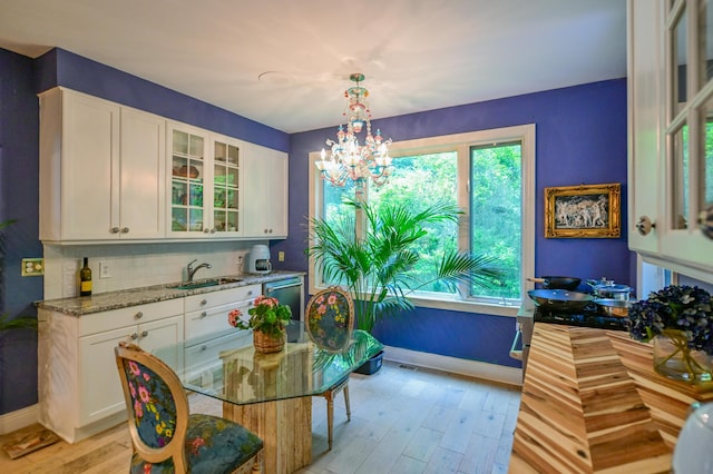 7394 Whitlind Ln, Athens, OH 45701 - dining space with a chandelier and light wood-style flooring
