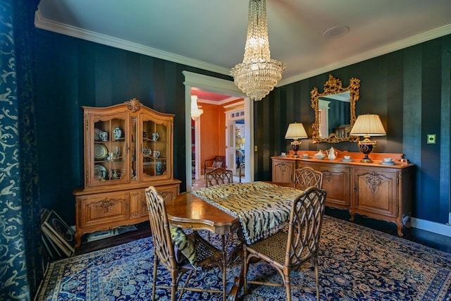 7394 Whitlind Ln, Athens, OH 45701 - dining space with a chandelier, crown molding, and wood finished floors