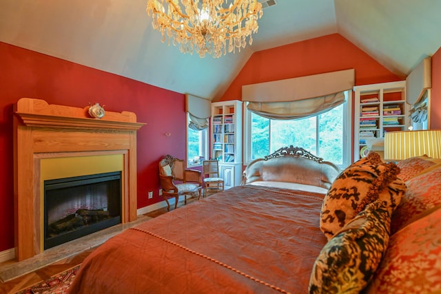 7394 Whitlind Ln, Athens, OH 45701 - bedroom featuring lofted ceiling, a chandelier, multiple windows, and a glass covered fireplace