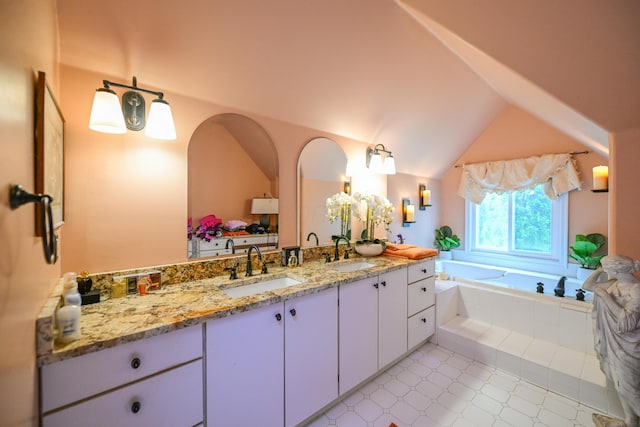 7394 Whitlind Ln, Athens, OH 45701 - bathroom with double vanity, a bath, and vaulted ceiling