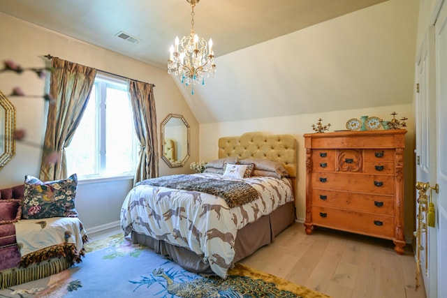7394 Whitlind Ln, Athens, OH 45701 - bedroom with light wood finished floors, lofted ceiling, and a chandelier
