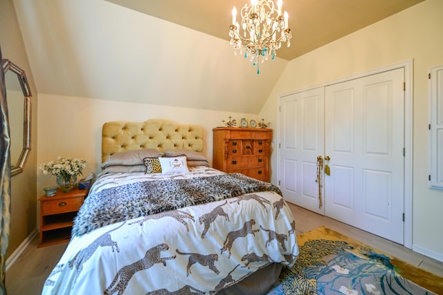 7394 Whitlind Ln, Athens, OH 45701 - bedroom featuring lofted ceiling, a closet, and a chandelier
