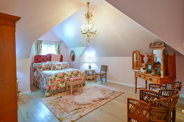 7394 Whitlind Ln, Athens, OH 45701 - bedroom featuring wood-type flooring, vaulted ceiling, and a chandelier