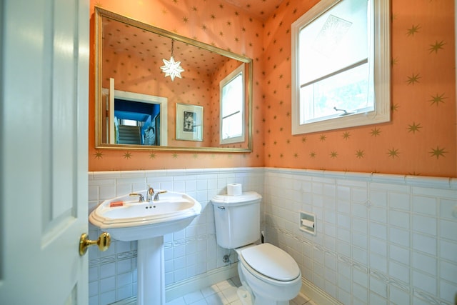 7394 Whitlind Ln, Athens, OH 45701 - bathroom with wainscoting, wallpapered walls, tile patterned flooring, and tile walls