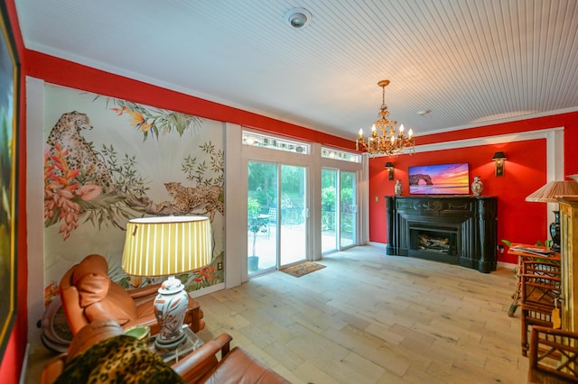 7394 Whitlind Ln, Athens, OH 45701 - living area with a chandelier, a fireplace, and wood finished floors