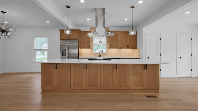 285 E Cherry St, Sunbury, OH 43074 - kitchen with stainless steel fridge, island exhaust hood, light countertops, light wood-style flooring, and recessed lighting
