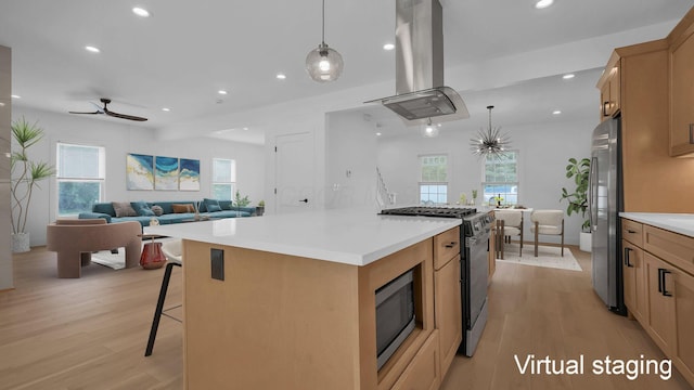 285 E Cherry St, Sunbury, OH 43074 - kitchen with island exhaust hood, stainless steel appliances, light wood-style flooring, recessed lighting, and a ceiling fan