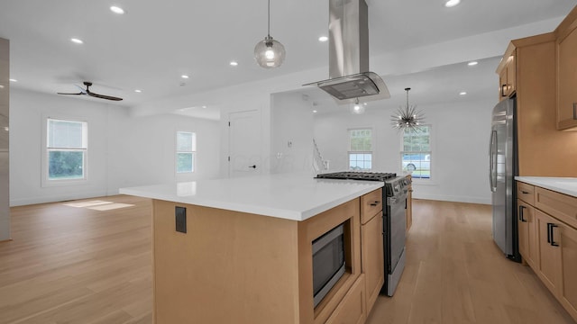 285 E Cherry St, Sunbury, OH 43074 - kitchen featuring island range hood, stainless steel appliances, light wood-style flooring, a ceiling fan, and recessed lighting