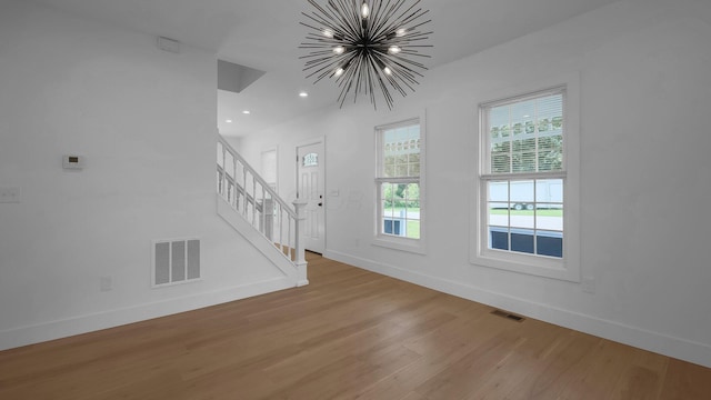 285 E Cherry St, Sunbury, OH 43074 - foyer entrance featuring light wood-style floors, a chandelier, stairs, and recessed lighting