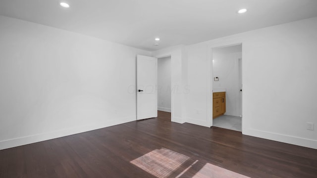 285 E Cherry St, Sunbury, OH 43074 - unfurnished bedroom featuring wood finished floors, recessed lighting, and ensuite bathroom