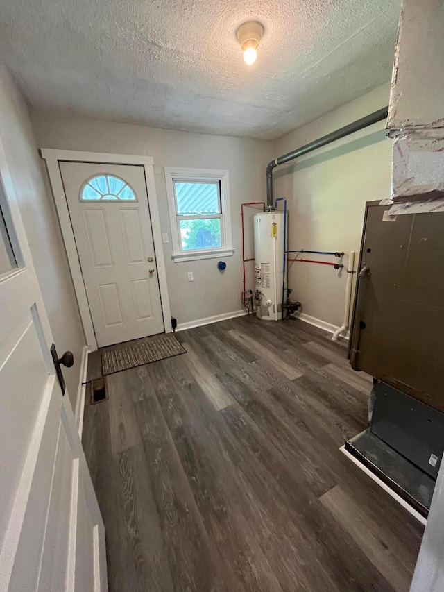 507 Broadway St, Washington Court House, OH 43160 - laundry area featuring gas water heater, a textured ceiling, and wood finished floors