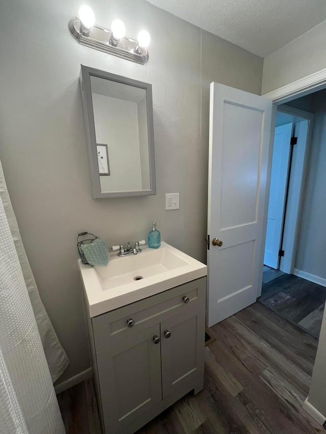 507 Broadway St, Washington Court House, OH 43160 - bathroom featuring wood finished floors and vanity