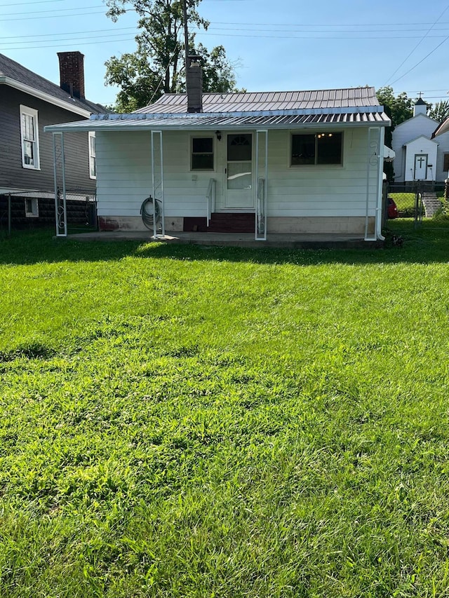 507 Broadway St, Washington Court House, OH 43160 - rear view of property with a metal roof, a chimney, and a standing seam roof