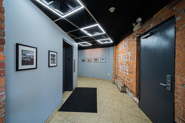 432 E Rich St Unit 3F, Columbus, OH 43215 - hall with brick wall and light tile patterned floors