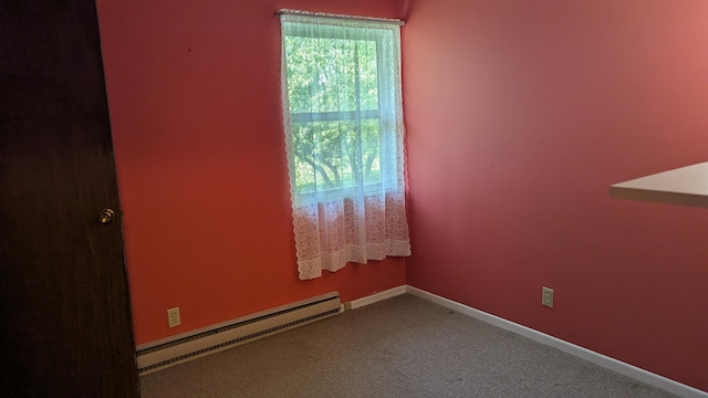 400 Forest Ln Unit 400, Richwood, OH 43344 - spare room featuring a baseboard heating unit and carpet flooring