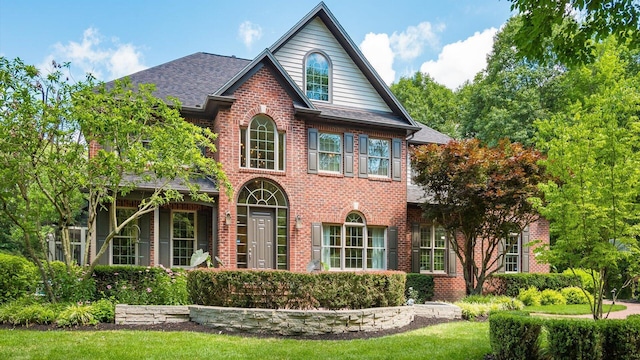 108 Hawks Cove Ct, Granville, OH 43023 - view of front of house featuring brick siding and roof with shingles