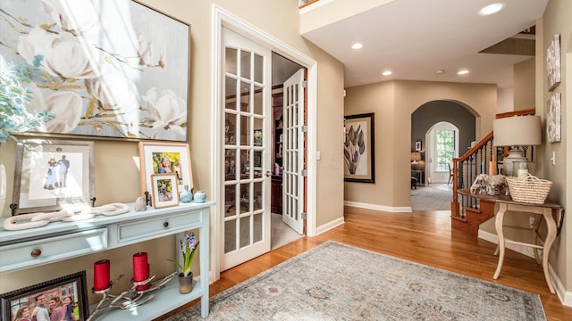 108 Hawks Cove Ct, Granville, OH 43023 - foyer entrance with arched walkways, wood finished floors, and recessed lighting